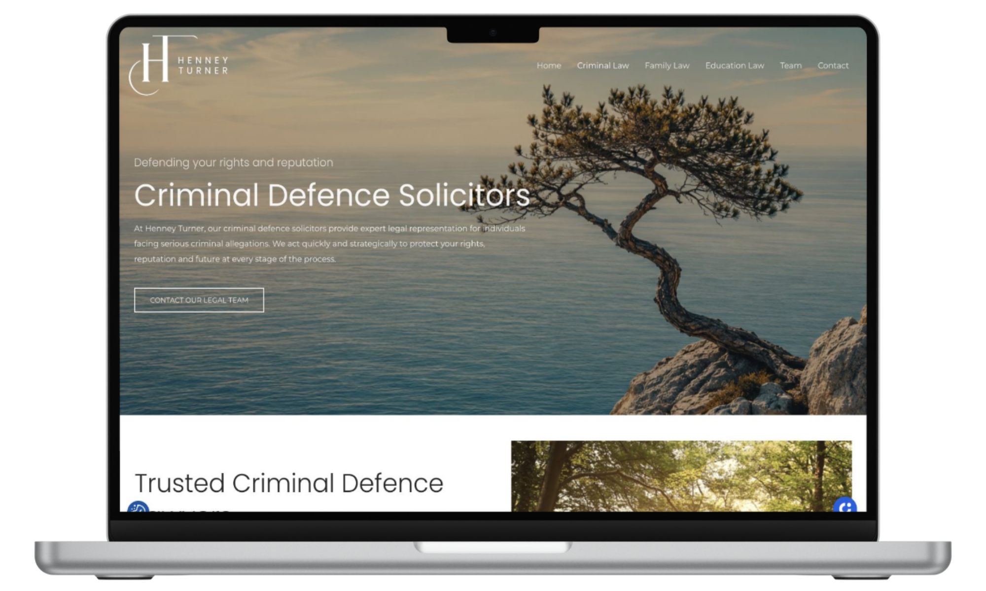 Henney Turner Criminal Defence Solicitors page shown on a MacBook Pro